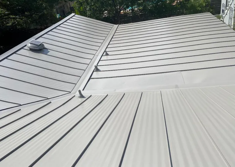Solar attic fan installed on a metal roof for Roof Ventilation in Rockledge